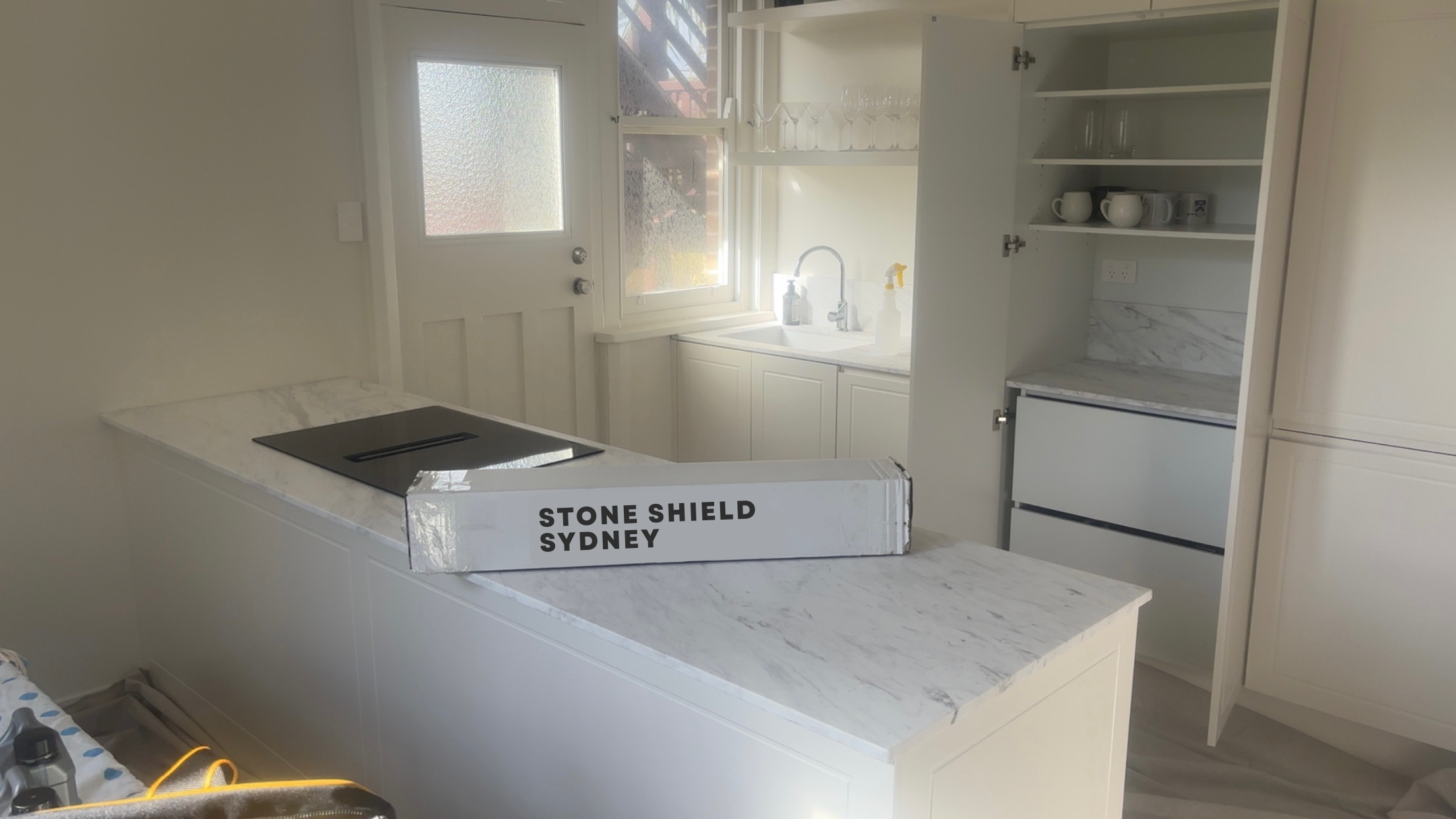Stone Shield Sydney film ready for installation on a marble kitchen benchtop