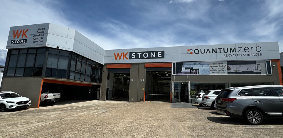 The WK Stone warehouse and showroom on Fairford Road, Padstow, with slabs visible through the open bays